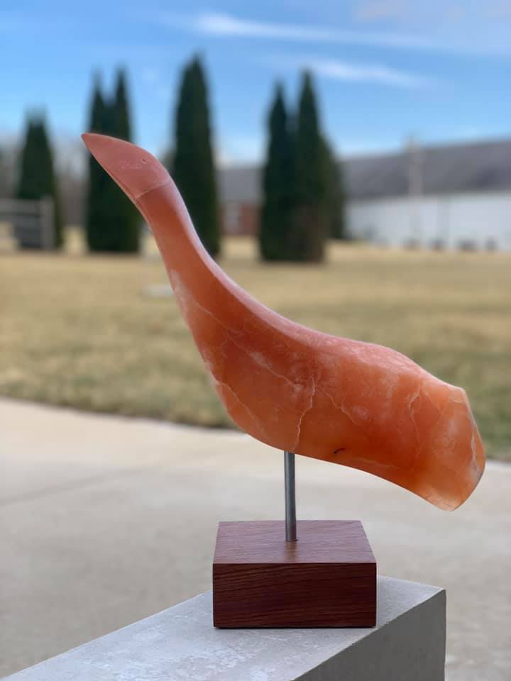 Orange alabaster sculpture of a crane